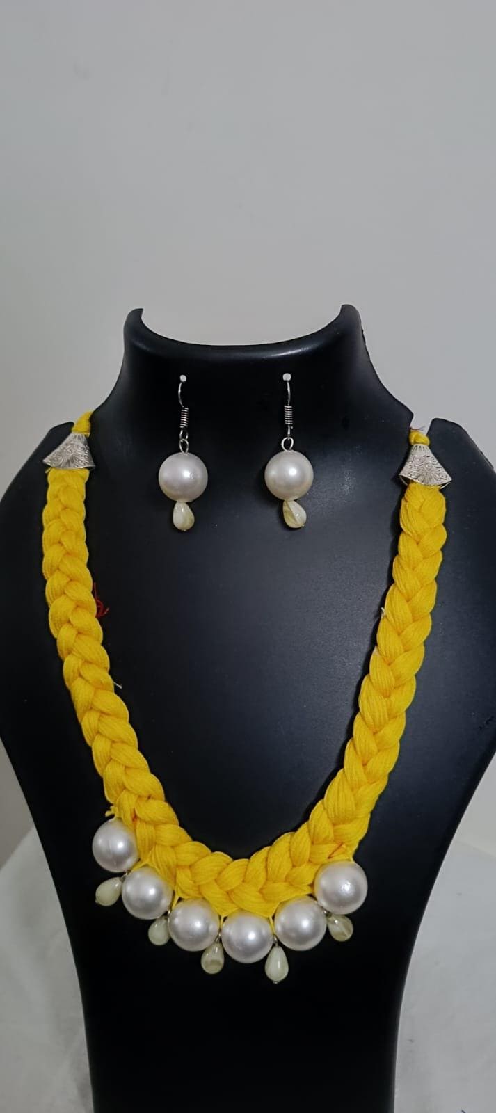Yellow  braided thread necklace with pearl n pearl danglers