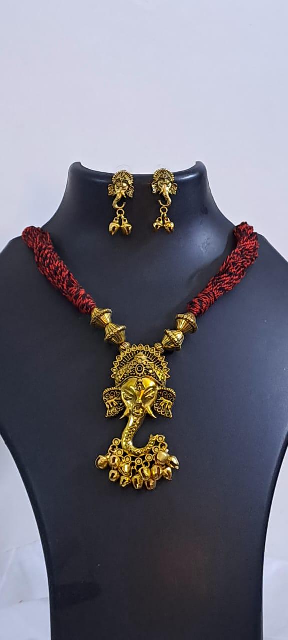 Red thread necklace with Golden oxidised traditional pendant