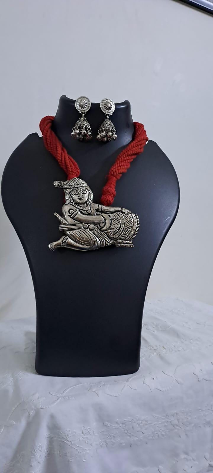 Red thread necklace with silver oxidised krishna pendant