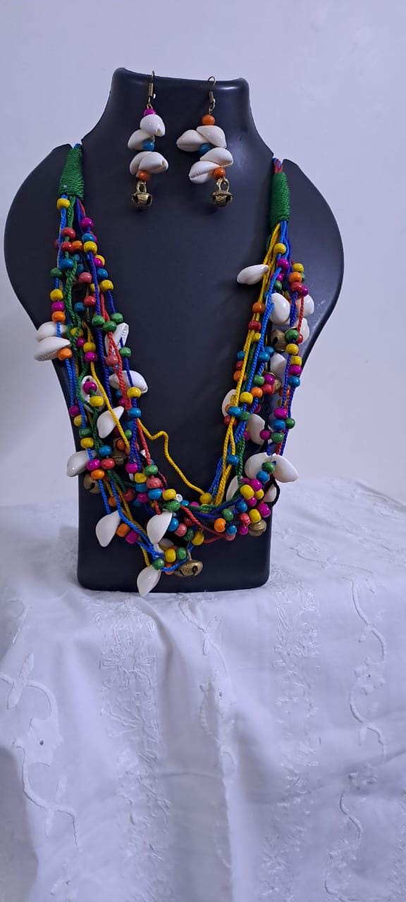 Exclusive multi-coloured and multi-layered thread necklace with shells, wooden beads n trinkets.