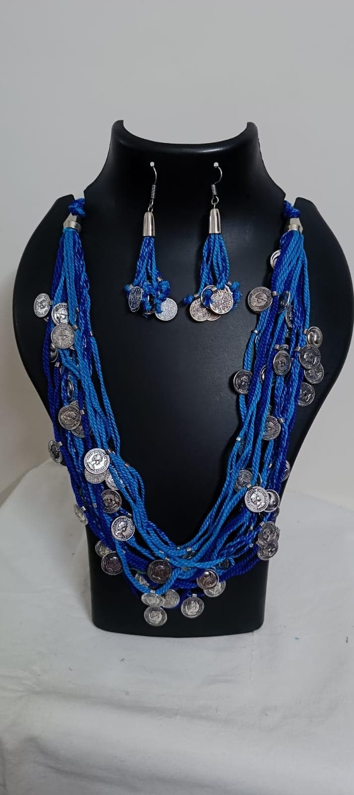 Exclusive multi-coloured and multi-layered thread necklace with silver oxidised charms