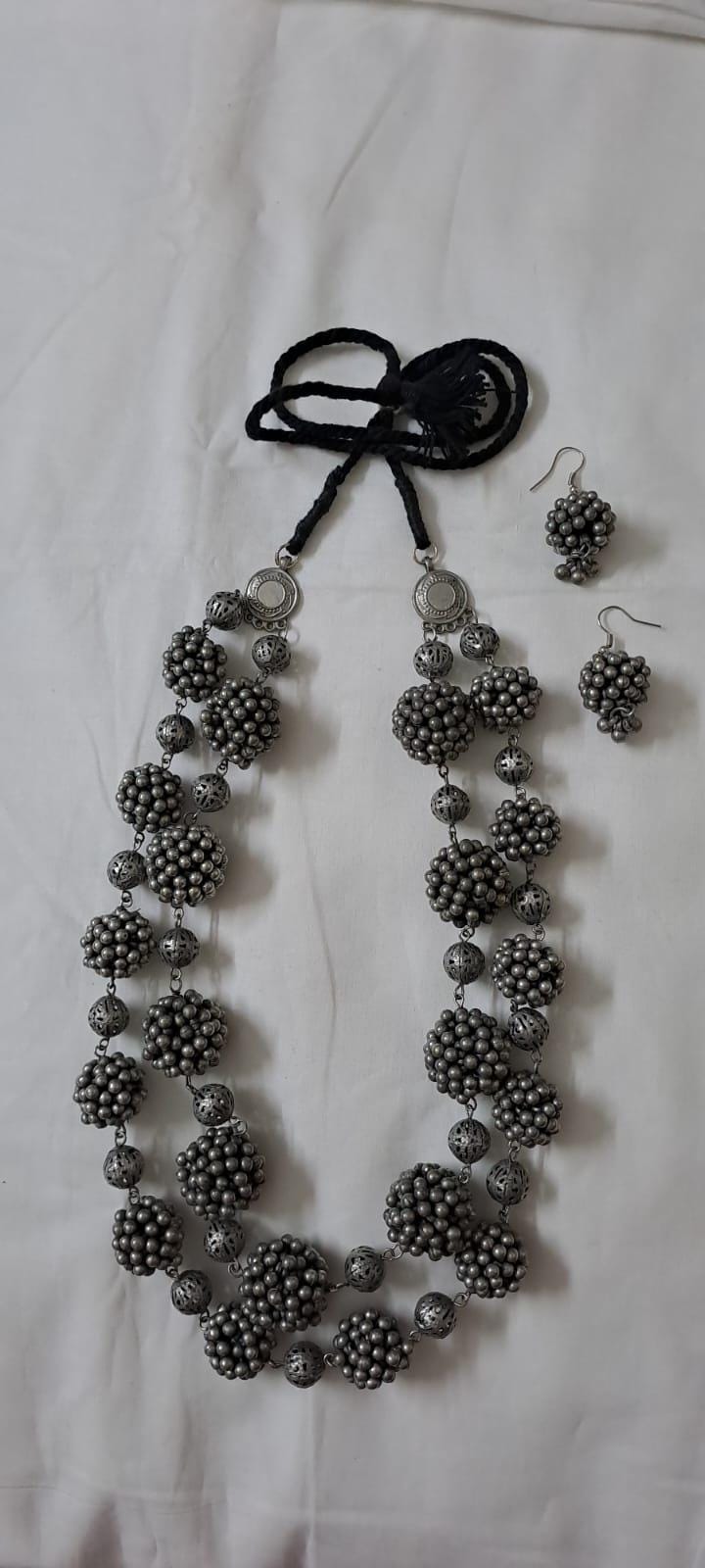 Exclusive silver oxidised long chain set with matching earrings