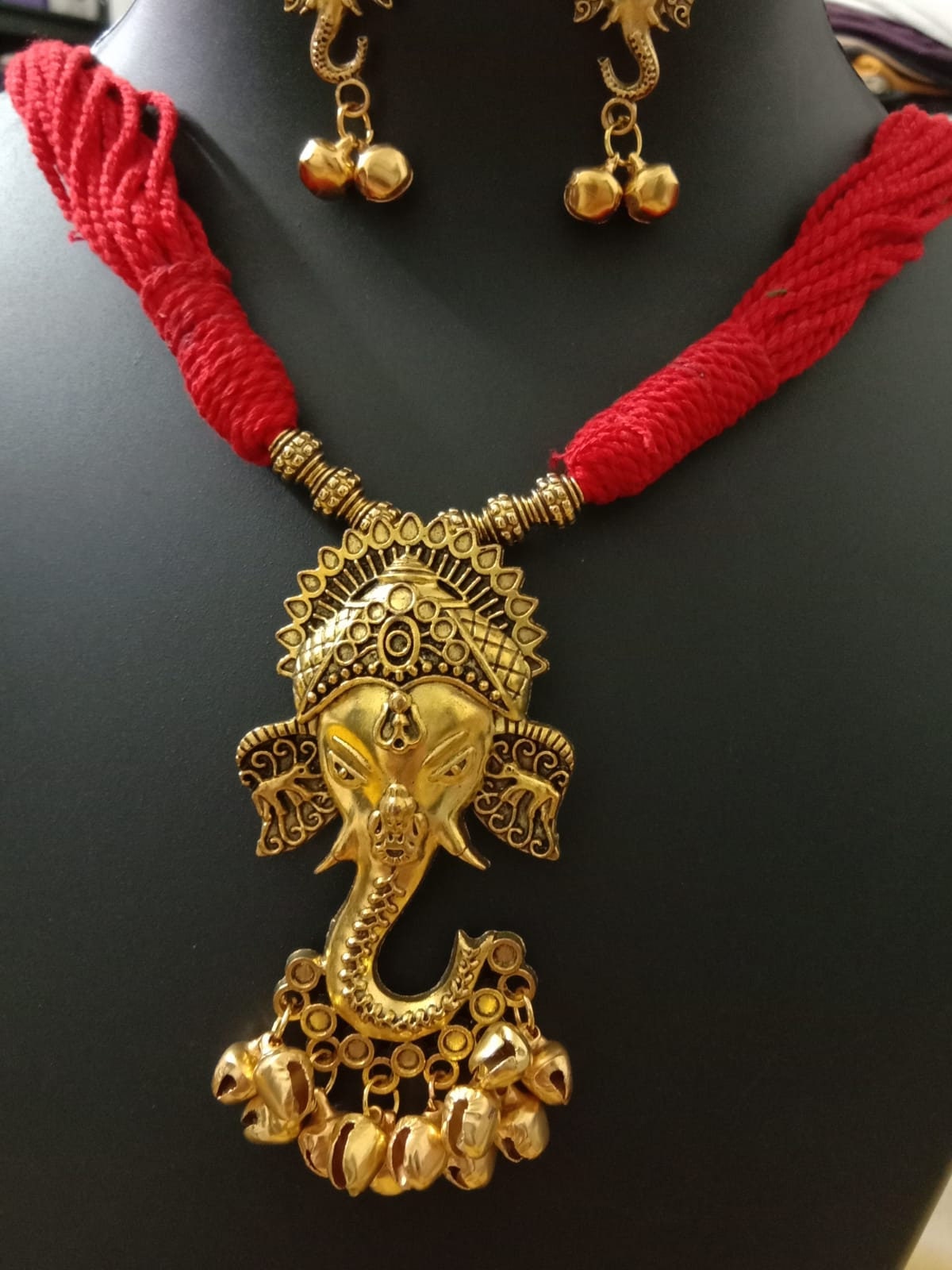 Oxidised golden ganesha traditional pendant and matching earrings.