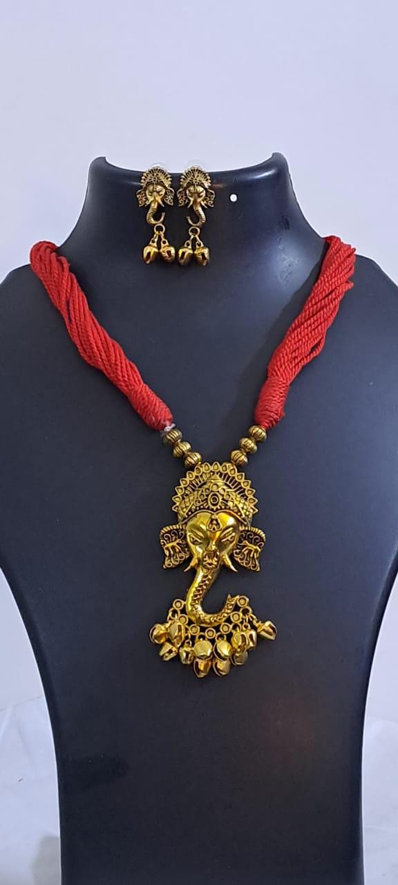 Red thread necklace with Golden oxidised traditional pendant