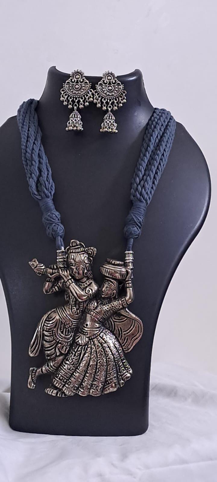 Radha Krishna silver oxidised pendant necklace in grey thread with matching earrings