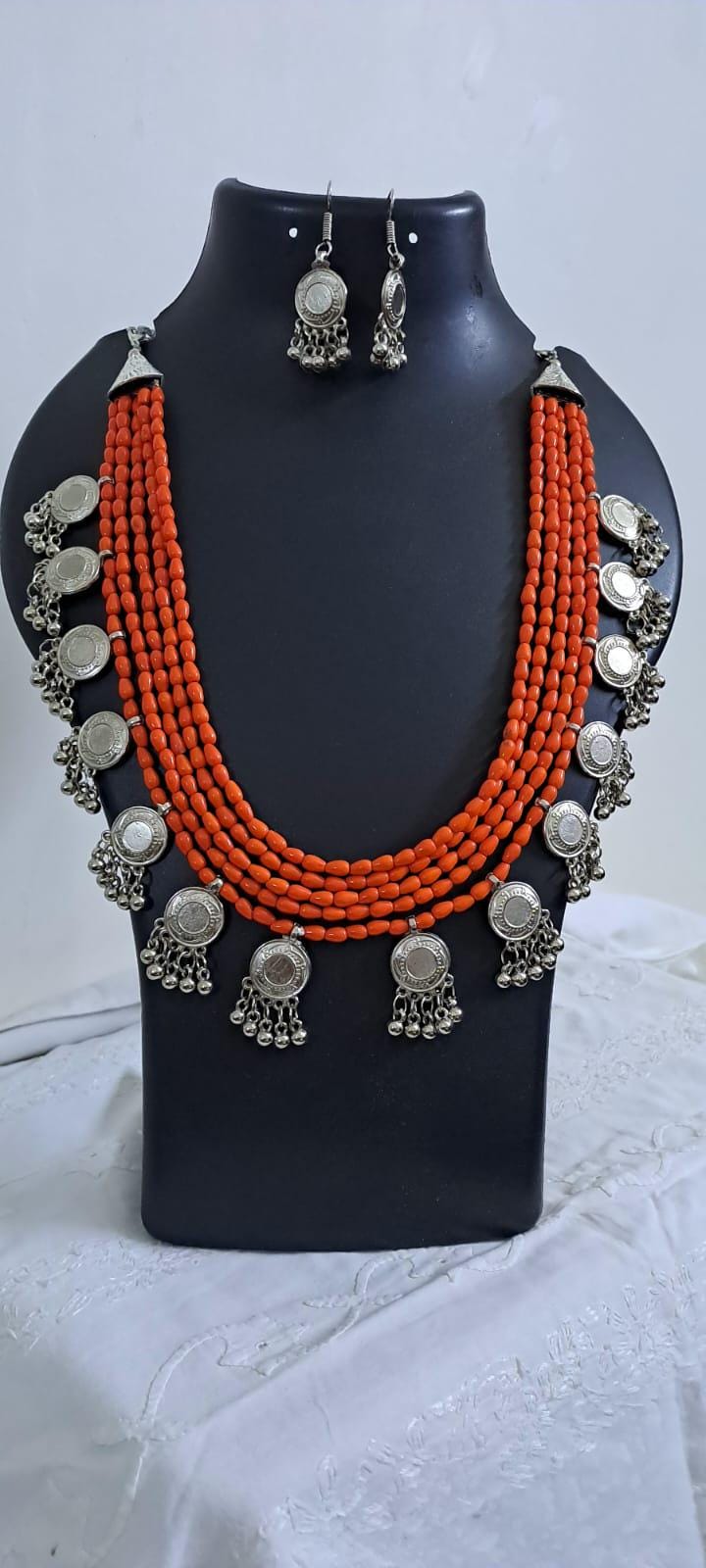 Exclusive multi layered  orange glass beads necklace set with silver oxidised charms n matching earrings