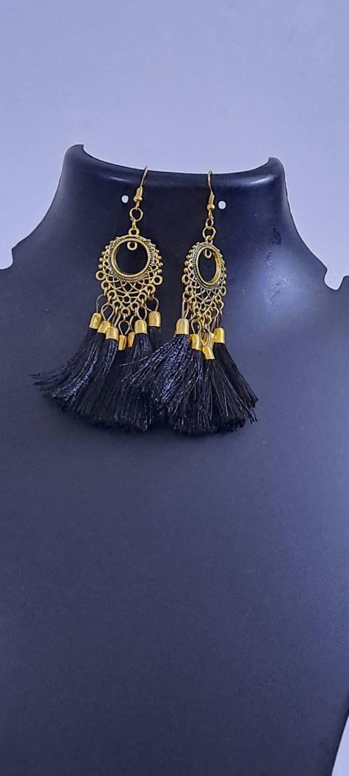 Golden neckband with black silk thread fringes and matching earrings