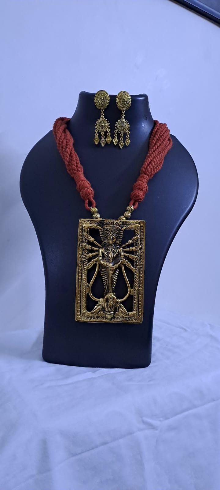 Brown  thread necklace with oxidised golden durga pendant