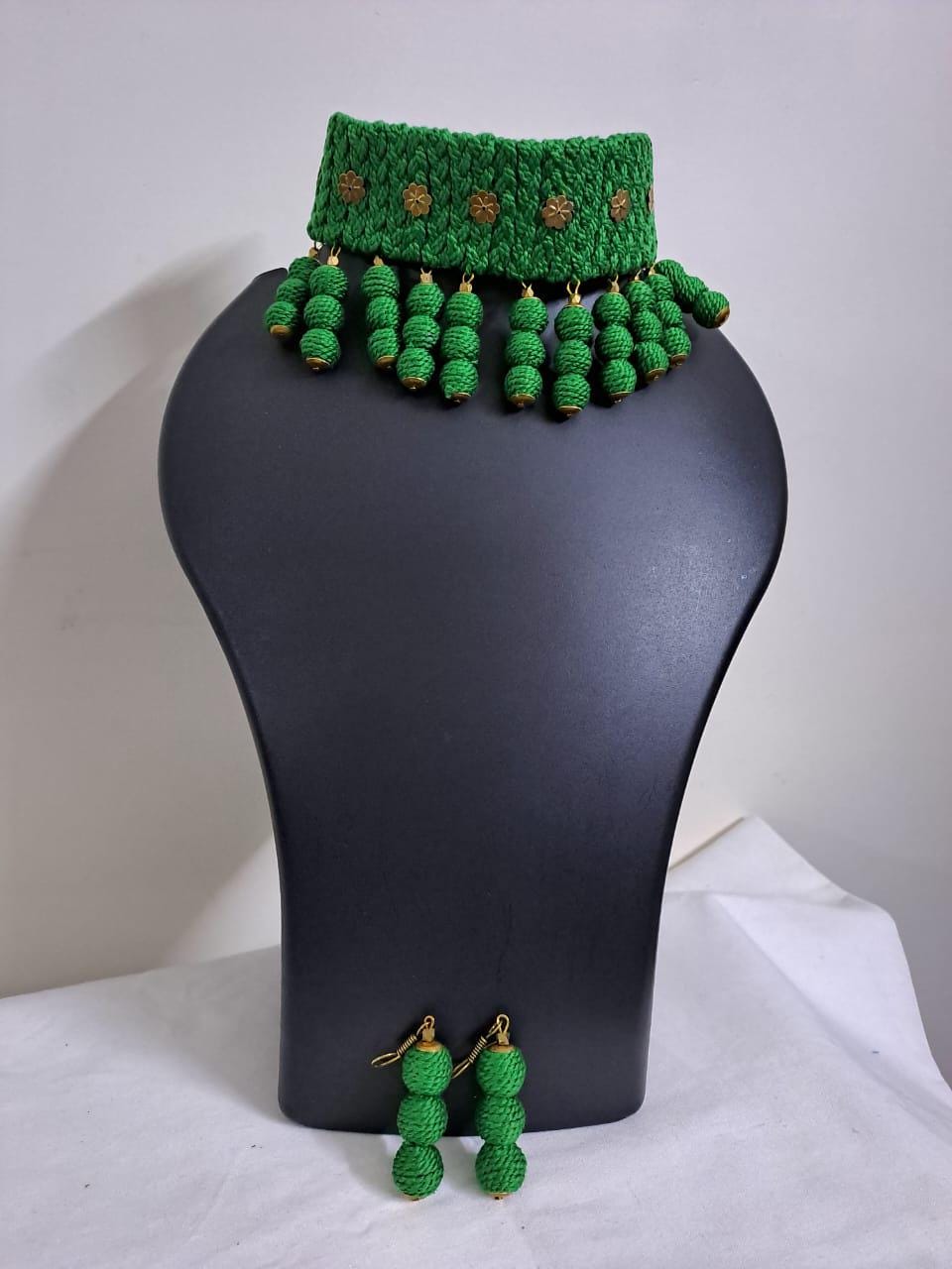 Green braided choker necklace set with fringes and matching earrings