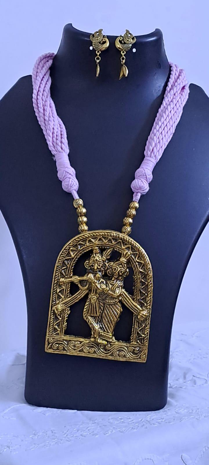 Radha Krishna golden oxidised pendant necklace in pink tread with matching earrings