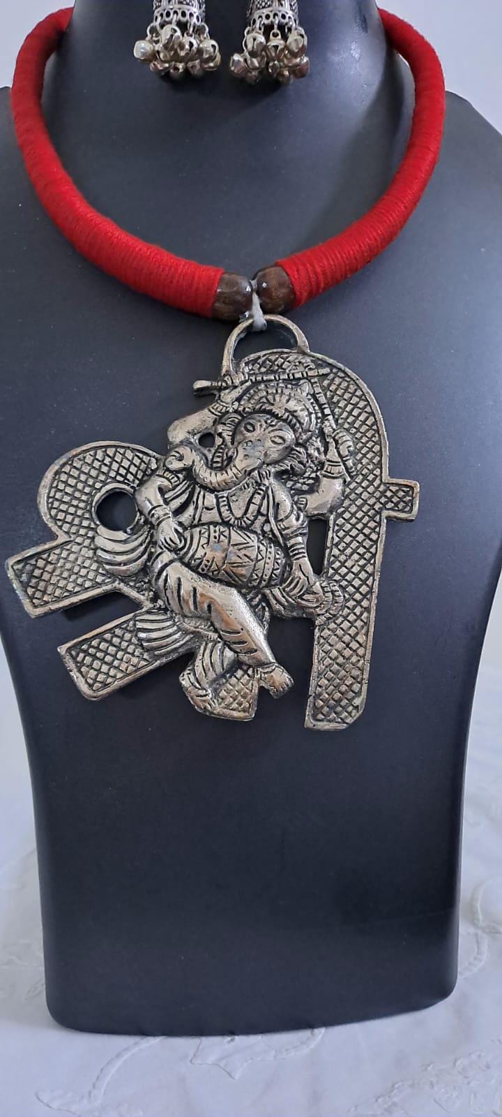 Red thread necklace with silver oxidised ganesha pendant