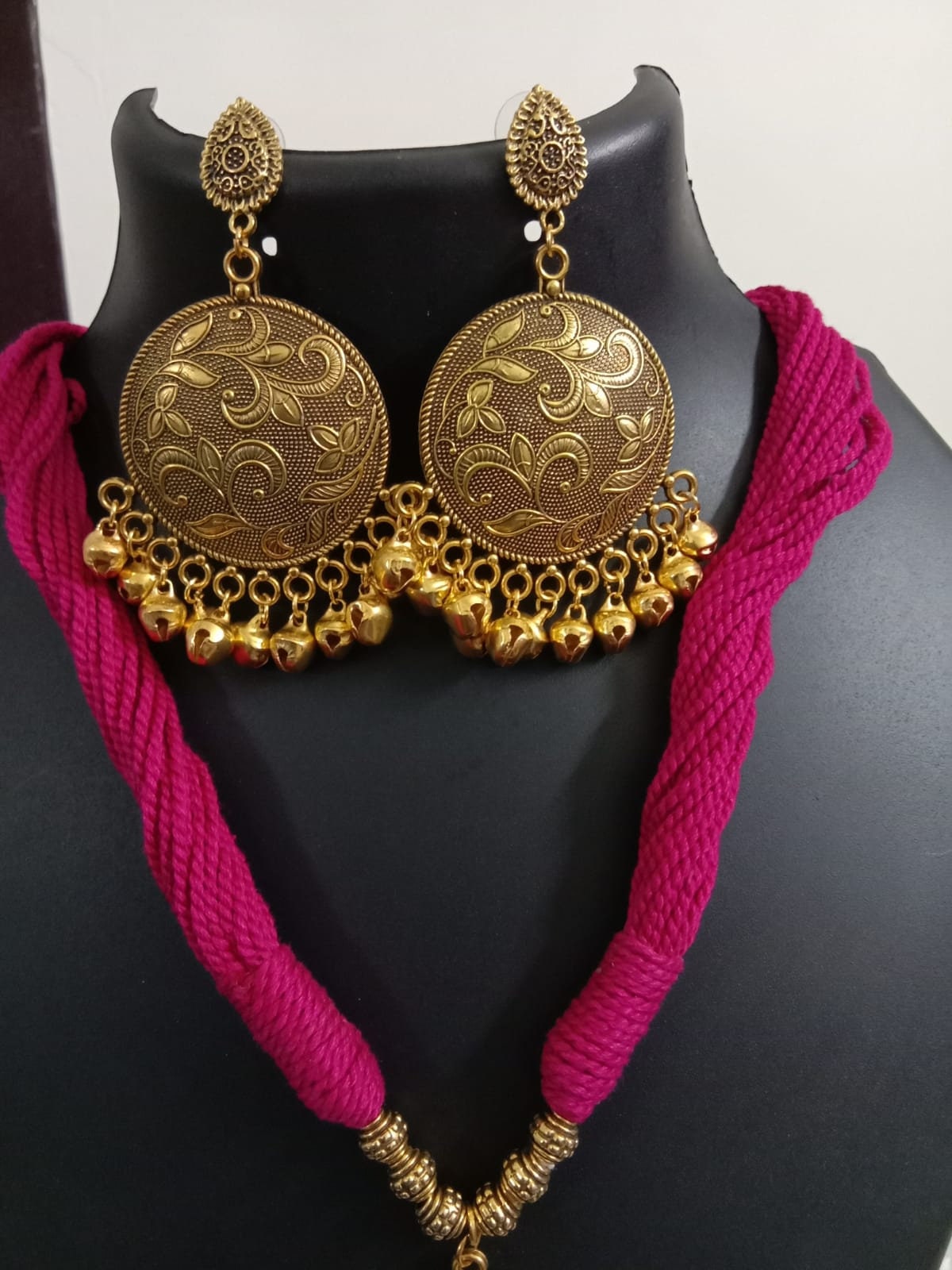 Red thread necklace with golden oxidised traditional pendant