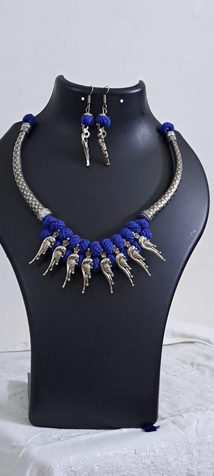 Blue thread necklace with kolhapuri silver oxidised traditional beads and matching earrings
