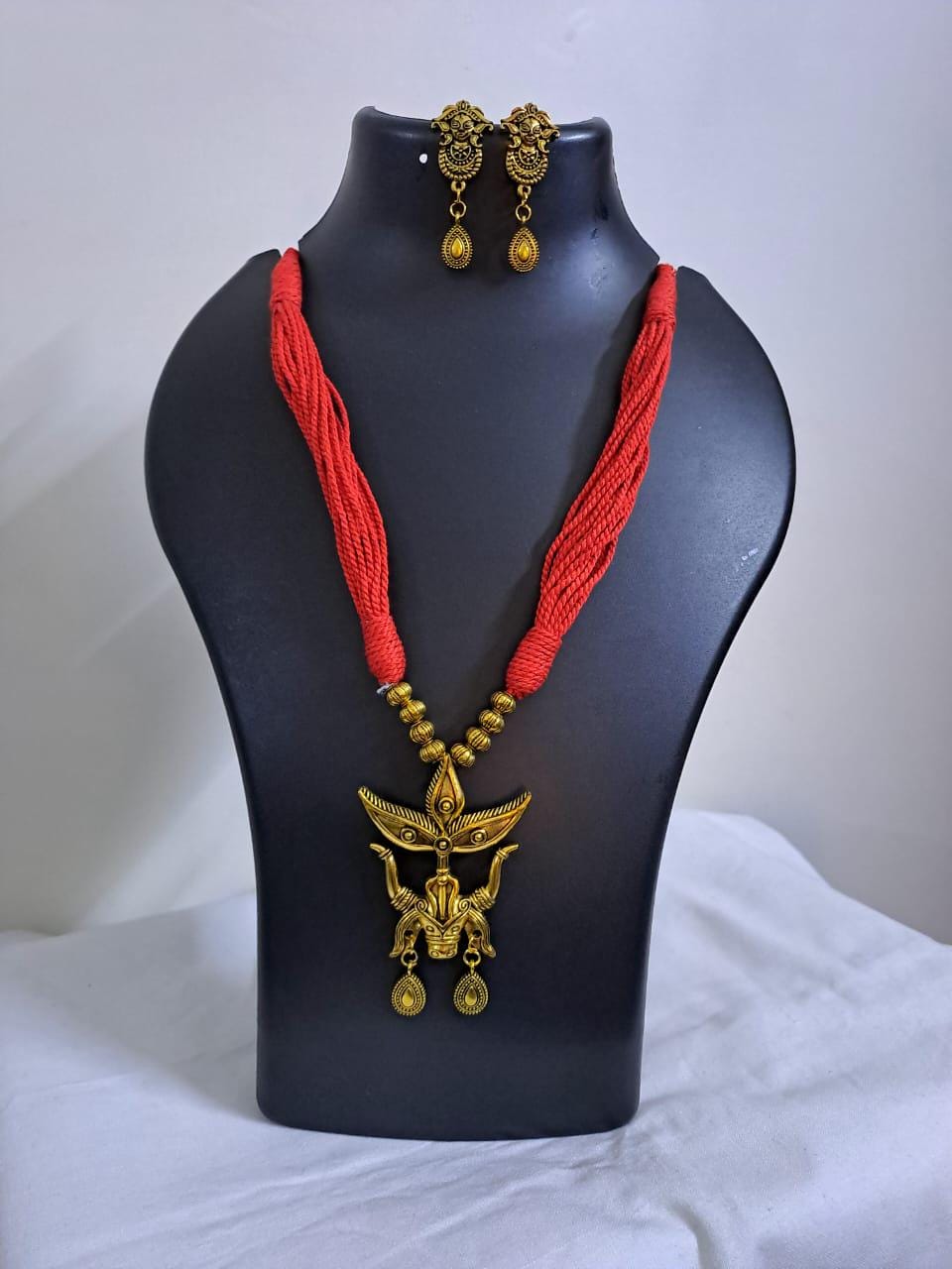Red thread necklace with golden oxidised Durga pendant n matching earrings