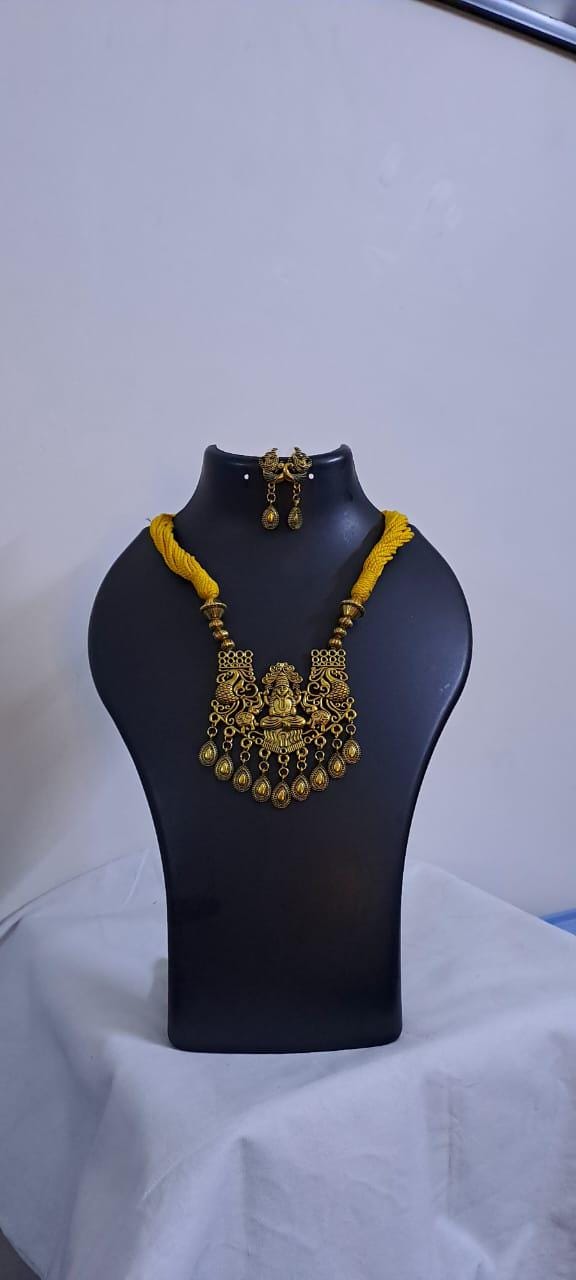 Yellow thread necklace with Golden oxidised traditional pendant