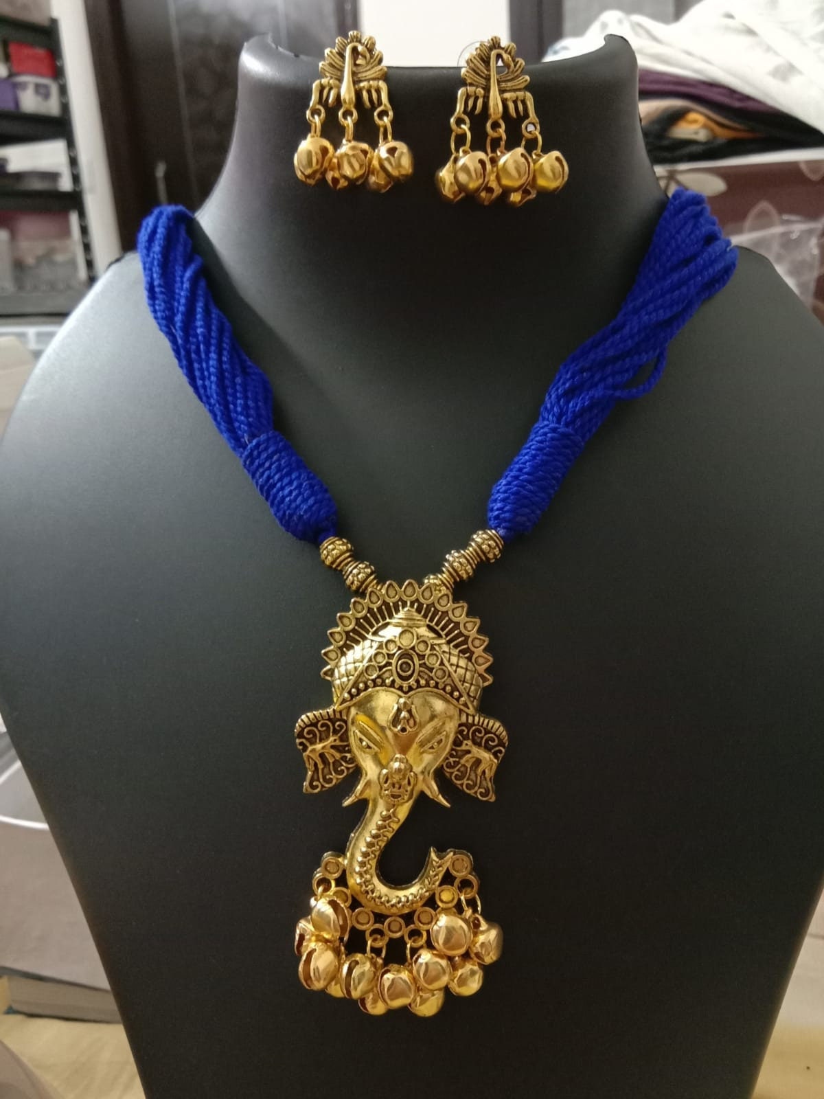 Oxidised golden ganesha traditional pendant and matching earrings.