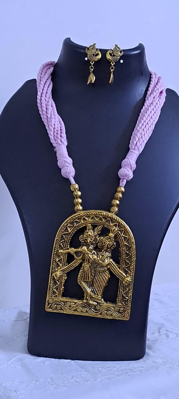 Radha Krishna golden oxidised pendant necklace in pink tread with matching earrings
