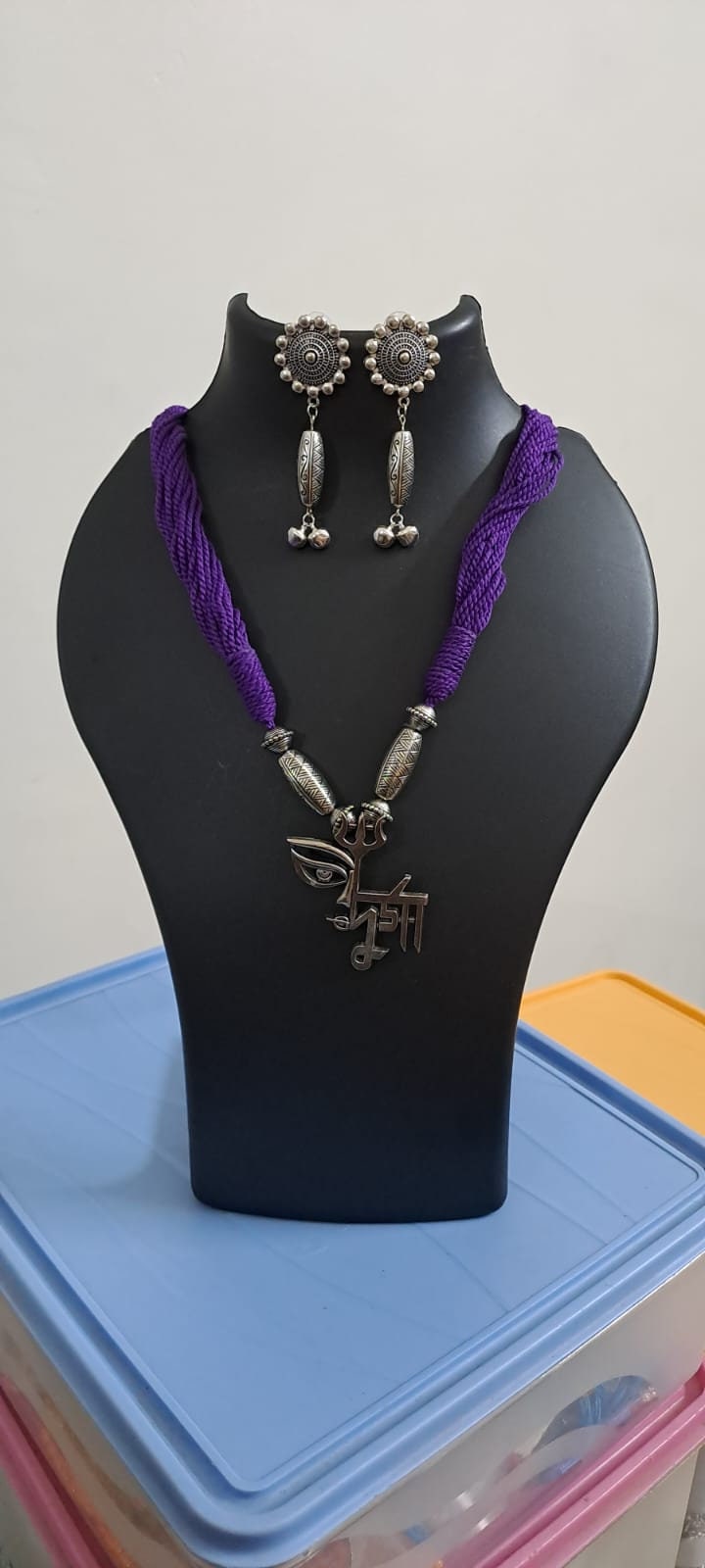 Purple thread necklace with oxidised silver durga pendant