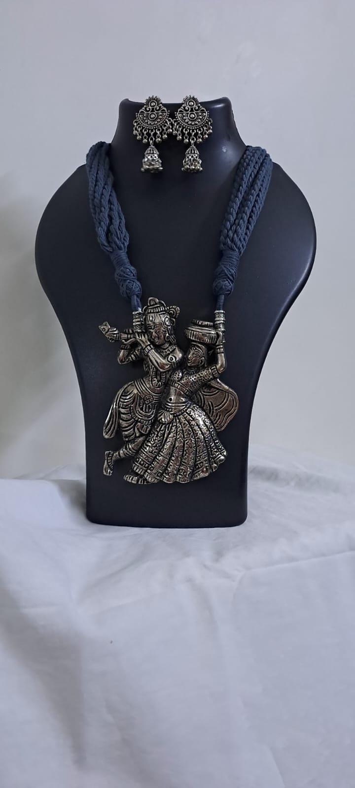 Radha Krishna silver oxidised pendant necklace in grey thread with matching earrings
