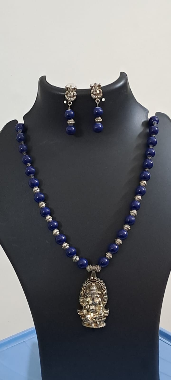Blue glass beads necklace with oxidised silver ganesha pendant