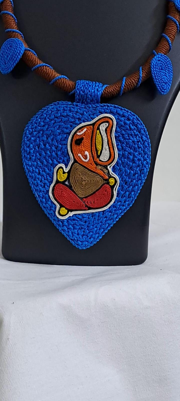 Exclusive brown and blue thread necklace with leaf shaped  Ganesha thread pendant and matching earrings.