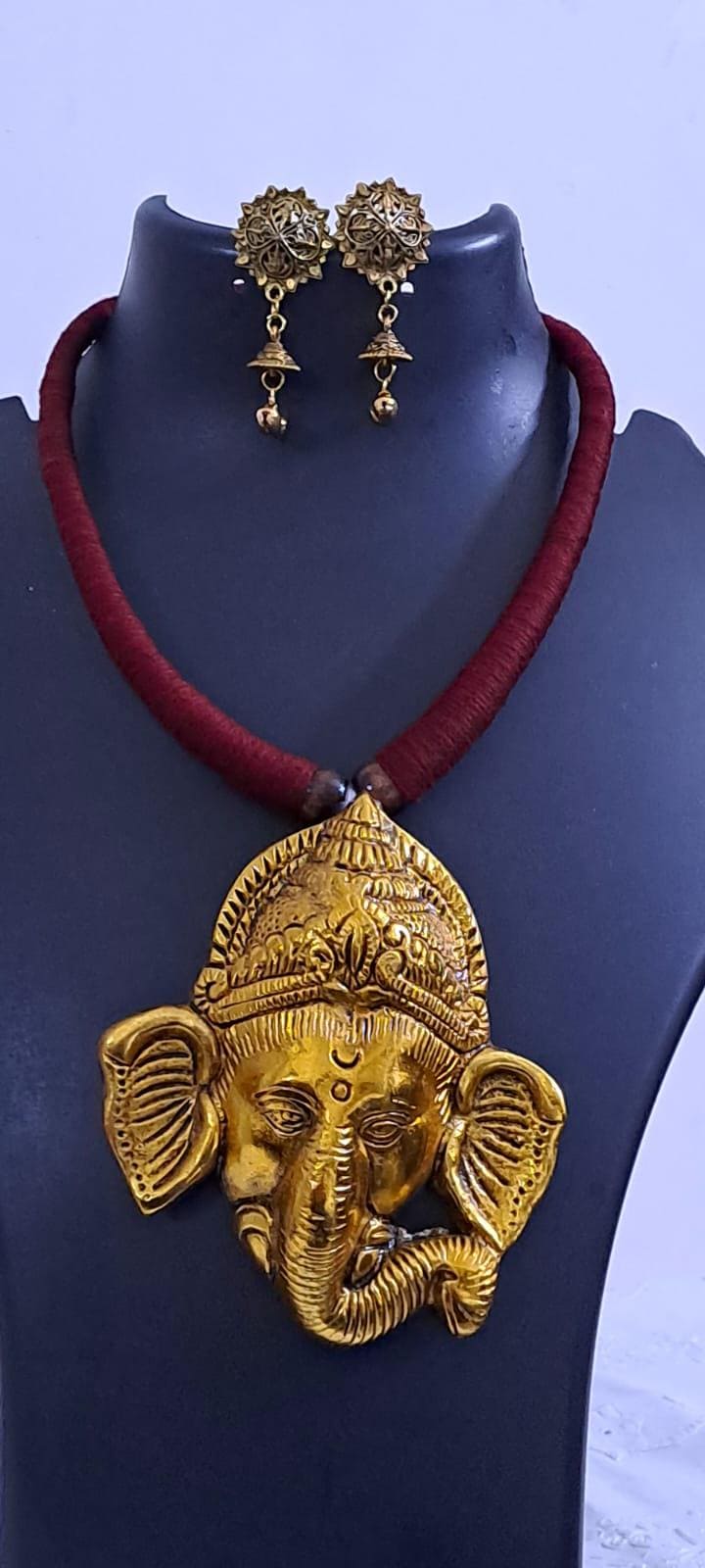 Maroon thread necklace with golden oxidised ganesha pendant