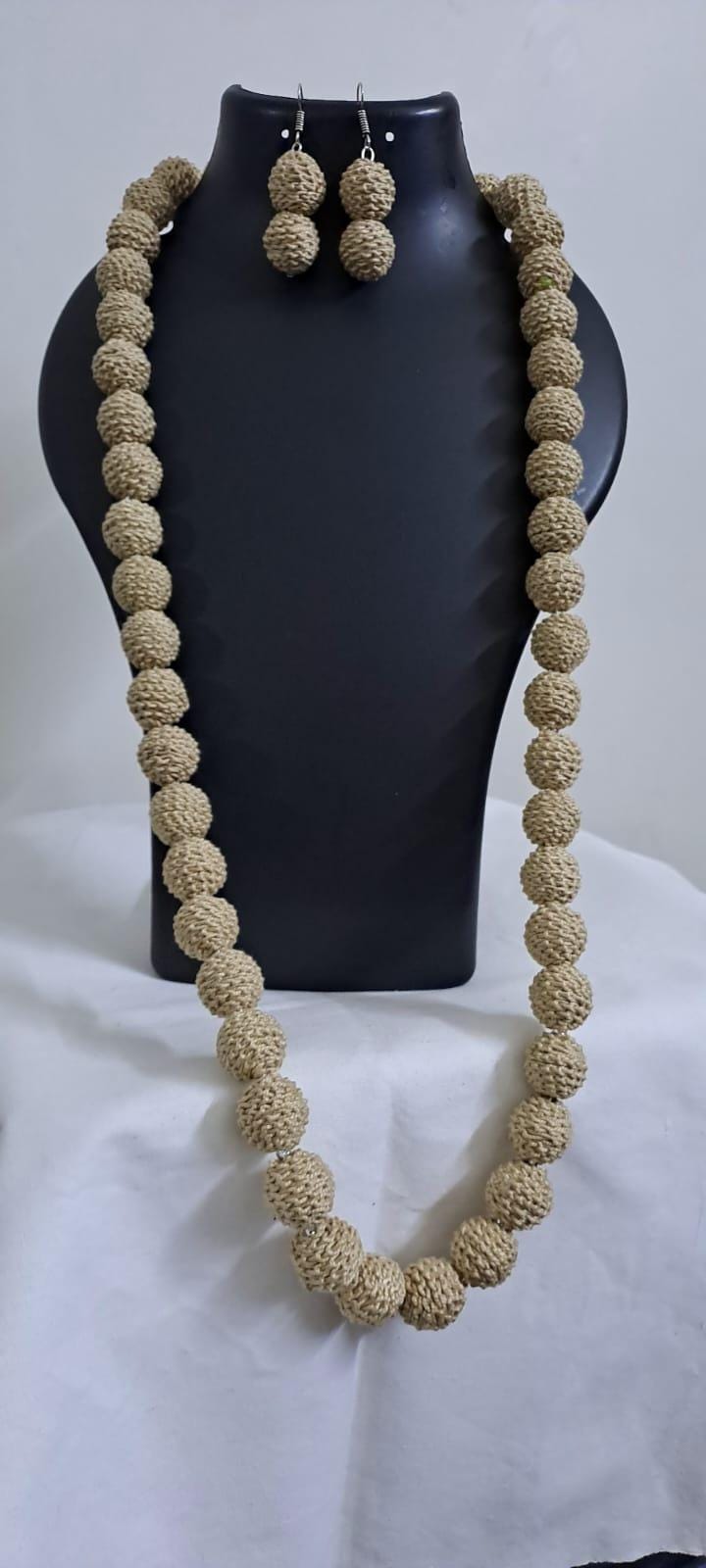 Exclusive beige colour thread beads long necklace set with matching earrings