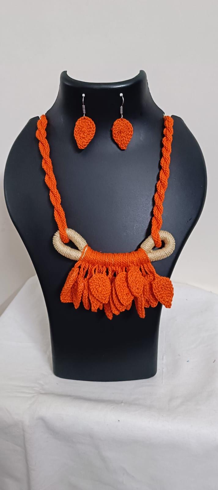 Orange Crochet thread necklace set with leaf fringes and matching earrings