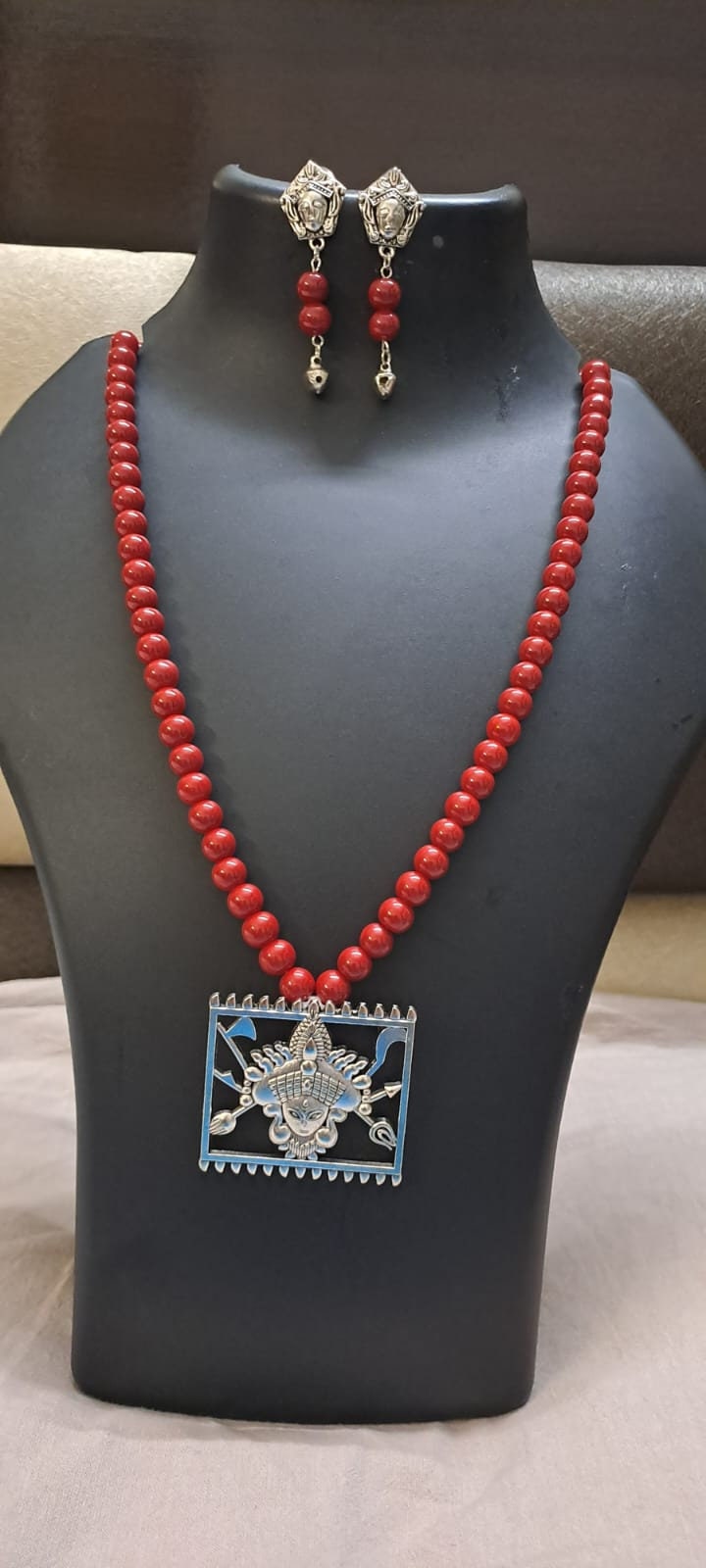 Red glass beads necklace with oxidised silver durga pendant