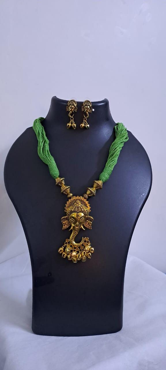 Green thread necklace with Golden oxidised traditional pendant