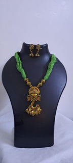 Green thread necklace with Golden oxidised traditional pendant