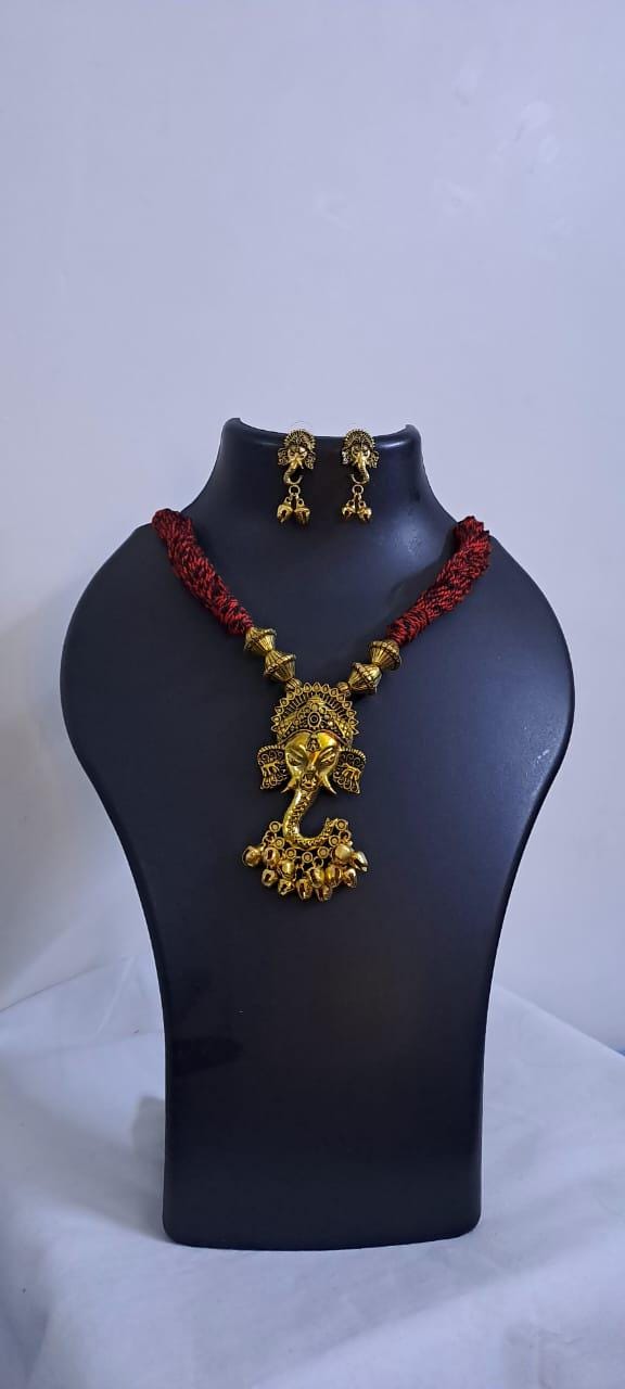 Red thread necklace with Golden oxidised traditional pendant