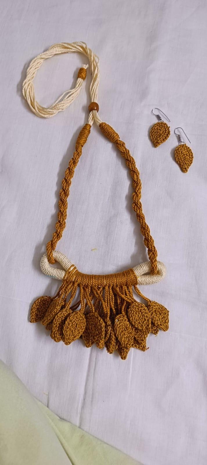 Golden brown Crochet thread necklace set with leaf fringes and matching earrings