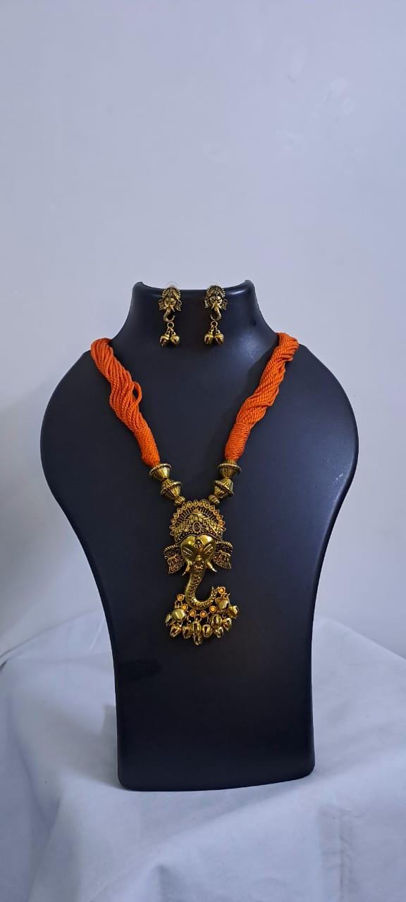 Orange thread necklace with Golden oxidised traditional pendant
