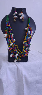 Exclusive multi-coloured and multi-layered thread necklace with shells, wooden beads n trinkets.