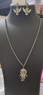 Oxidised silver chain with owl pendant and matching earrings.