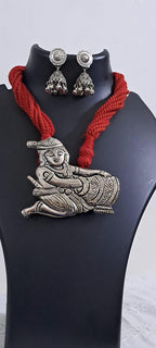 Red thread necklace with silver oxidised krishna pendant