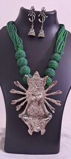 Green thread necklace with oxidised golden durga pendant