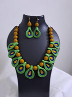 Green n yellow thread necklace with matching thread earrings.