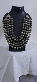 Multi-layered silver oxidised beads necklace .