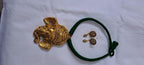 Green thread necklace with golden oxidised ganesha pendant