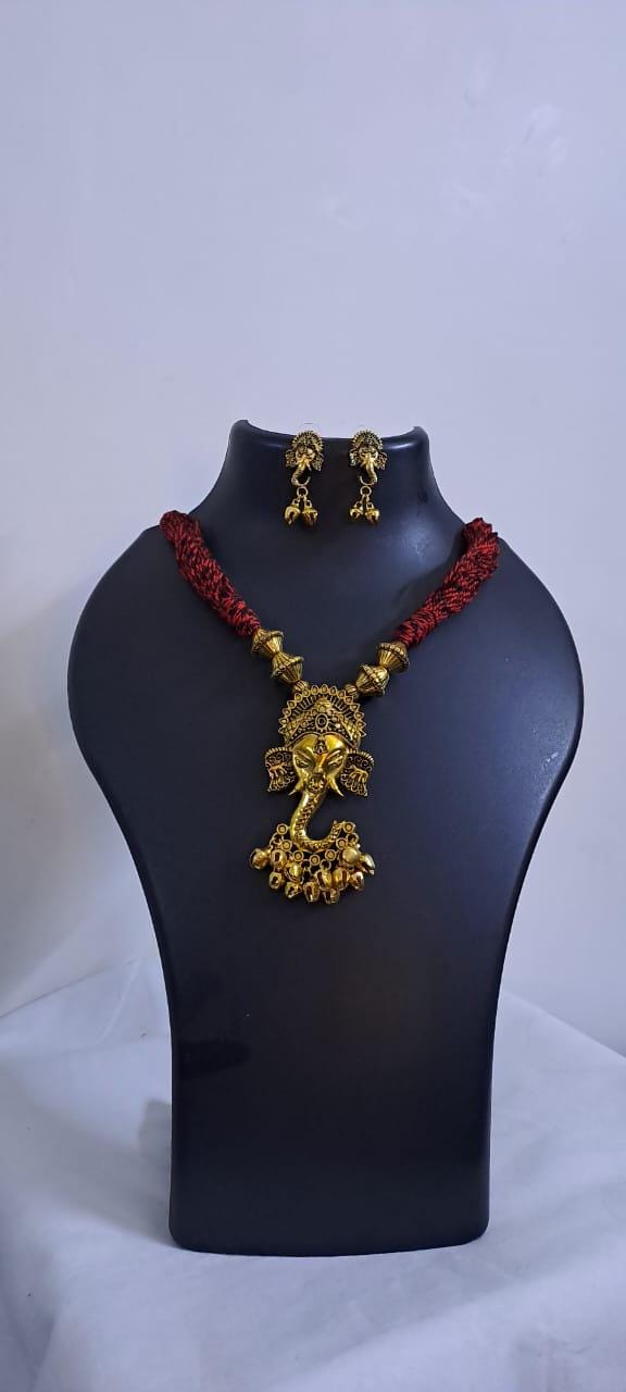 Red thread necklace with Golden oxidised traditional pendant