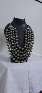 Multi-layered silver oxidised beads necklace .