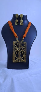 Orange thread necklace with oxidised golden durga pendant