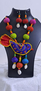 Exclusive fabric necklace with embroidered blue fabric bird pendant and fabric beads n matching beads
