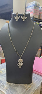 Oxidised silver chain with owl pendant and matching earrings.