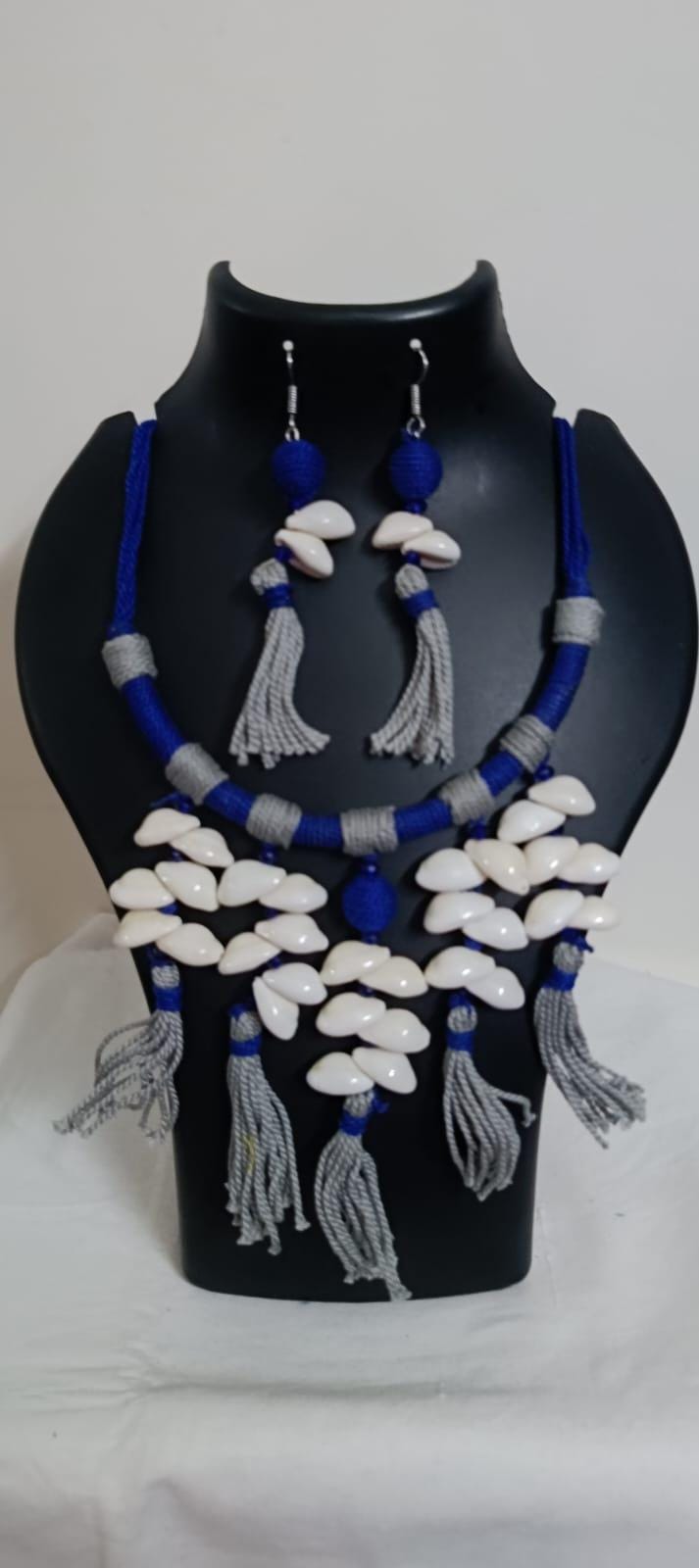 Exclusive blue n grey hasuli thread necklace set with shell fringes n matching earrings