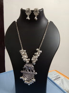 Oxidised silver chain with traditional pendant and matching earrings.
