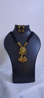 Black thread necklace with Golden oxidised traditional pendant