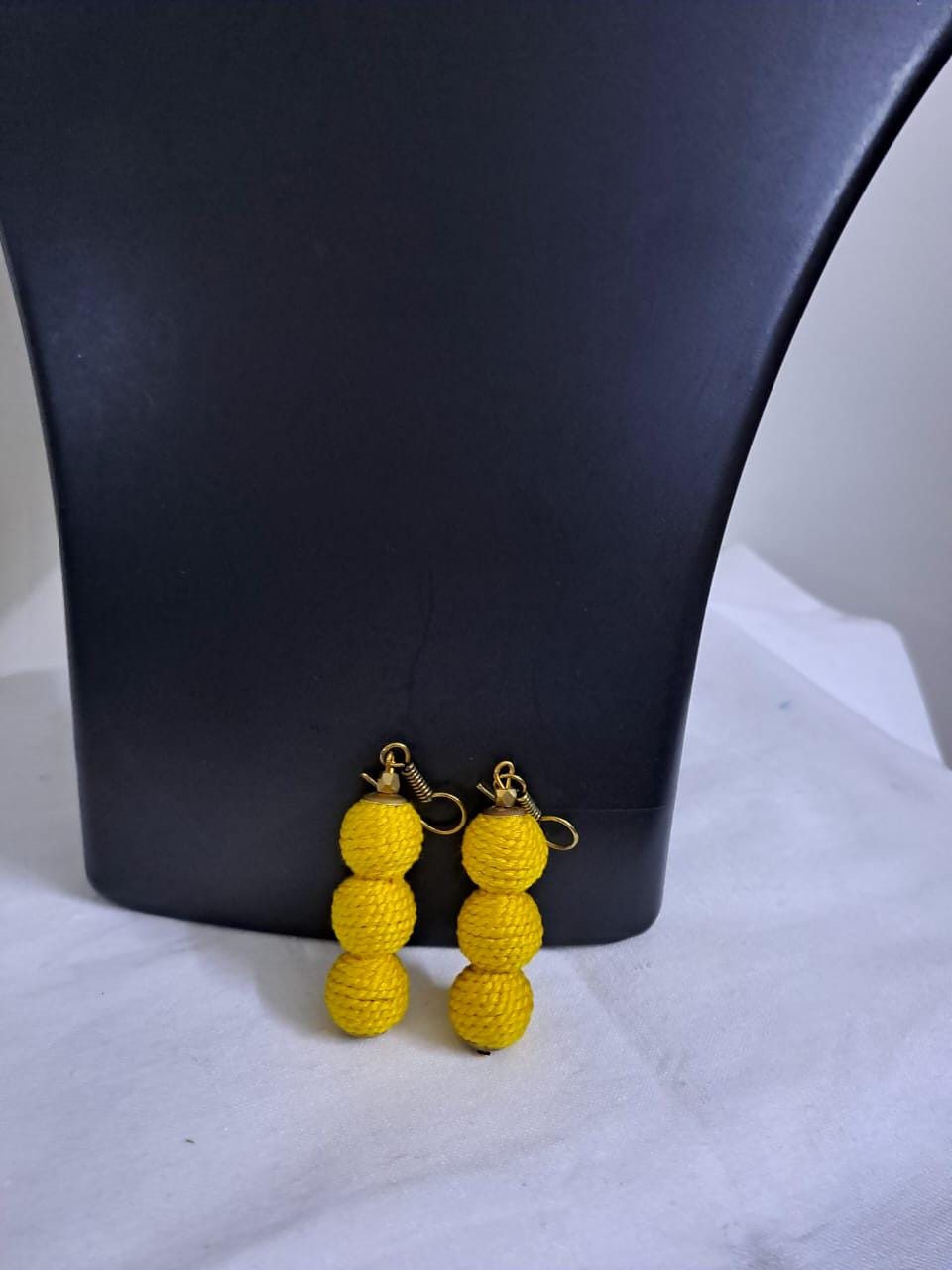 Yellow braided choker necklace set with fringes and matching earrings